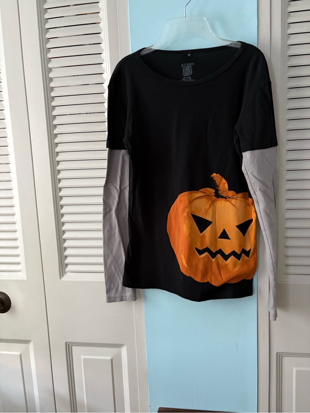 Cute Halloween Top with print and bats on sleeves.
